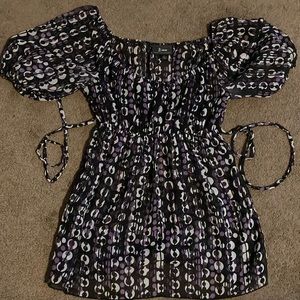 Blouse top with tie backs at waist and puffy sleeve with elastic cuff